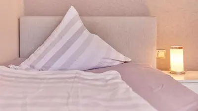 Ein Bett oder Betten in einem Zimmer der Unterkunft Cafe Rosi