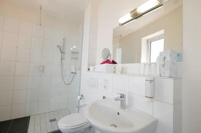 Ein Badezimmer in der Unterkunft Hotel Moseldomizil
