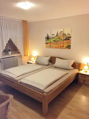 Ein Bett oder Betten in einem Zimmer der Unterkunft Gästehaus Doll