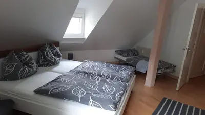 Ein Bett oder Betten in einem Zimmer der Unterkunft Wohnen bei den Brückenhäusern