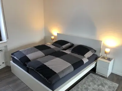 Ein Bett oder Betten in einem Zimmer der Unterkunft Ferienwohnung 