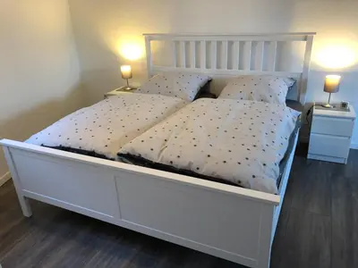 Ein Bett oder Betten in einem Zimmer der Unterkunft Ferienwohnung 