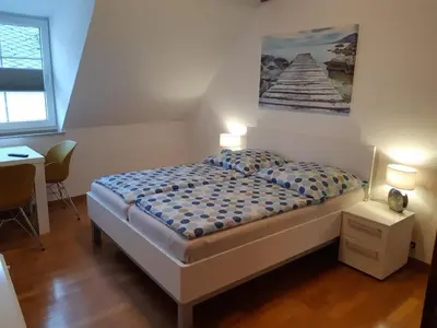 Ein Bett oder Betten in einem Zimmer der Unterkunft Ferienhaus Würzgarten