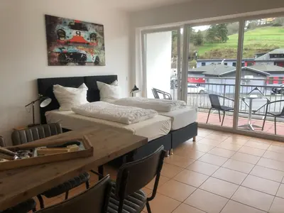 Ein Bett oder Betten in einem Zimmer der Unterkunft NringRooms Exit-Breidscheid