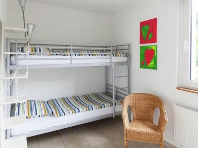 Ein Bett oder Betten in einem Zimmer der Unterkunft Forest-Edge Family Retreat