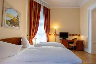 Ein Bett oder Betten in einem Zimmer der Unterkunft Hotel Schloss Rheinfels