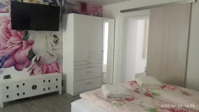Ein Bett oder Betten in einem Zimmer der Unterkunft Gästehaus - Café Frank