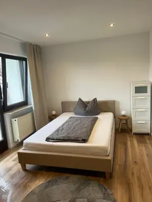 Ein Bett oder Betten in einem Zimmer der Unterkunft Pension Zur Linde