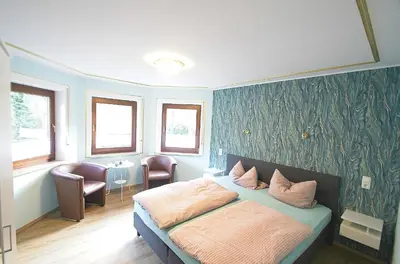 Ein Bett oder Betten in einem Zimmer der Unterkunft Pension Belzer