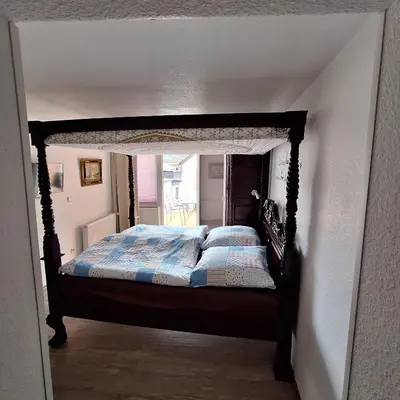 Ein Bett oder Betten in einem Zimmer der Unterkunft Gästehaus Kretschmann
