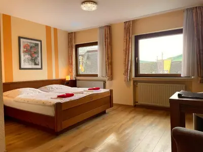 Ein Bett oder Betten in einem Zimmer der Unterkunft Ferienpension bei Stenze inklusive kostenlosem regionalem Nahverkehr