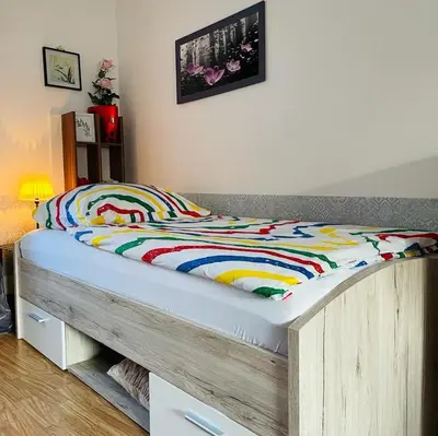 Ein Bett oder Betten in einem Zimmer der Unterkunft Ferienwohnung in Binger Stadtmitte mit Balkon