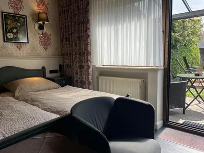 Ein Bett oder Betten in einem Zimmer der Unterkunft Pension Zum Golfstübchen
