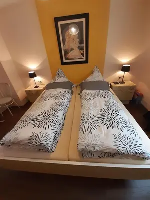 Ein Bett oder Betten in einem Zimmer der Unterkunft Gastehaus am Calmont