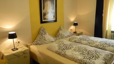 Ein Bett oder Betten in einem Zimmer der Unterkunft Gastehaus am Calmont