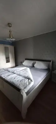 Ein Bett oder Betten in einem Zimmer der Unterkunft FeWo Am Marktplatz
