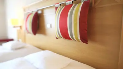 Ein Bett oder Betten in einem Zimmer der Unterkunft Landidyll Hotel Restaurant Birkenhof