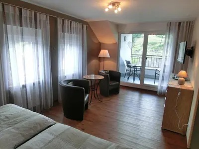 Ein Bett oder Betten in einem Zimmer der Unterkunft Ferienweingut Hirschen Schulstraße