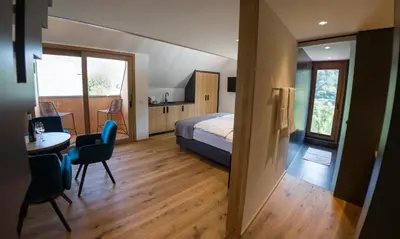 Ein Bett oder Betten in einem Zimmer der Unterkunft Rieslingquartier - Mosel Wein Hotel