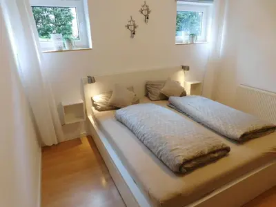 Ein Bett oder Betten in einem Zimmer der Unterkunft Ferienwohnung Elsbeere