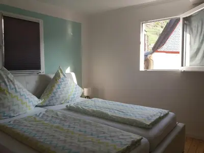 Ein Bett oder Betten in einem Zimmer der Unterkunft Anna´s Häuschen