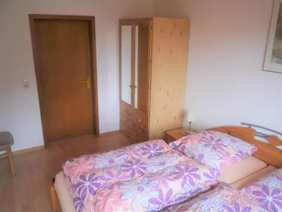 Ein Bett oder Betten in einem Zimmer der Unterkunft Vulkaneifel-Ferienwohnungen am Felsenpfad