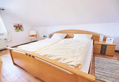 Ein Bett oder Betten in einem Zimmer der Unterkunft Gästehaus La Madonnina