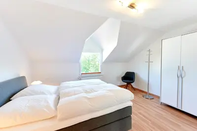 Ein Bett oder Betten in einem Zimmer der Unterkunft Ferienweingut Willems