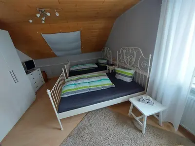 Ein Bett oder Betten in einem Zimmer der Unterkunft Ferienwohnung am Lieserpfad
