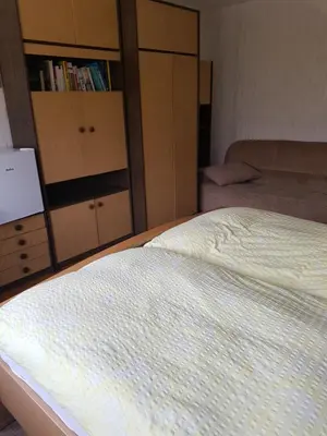 Ein Bett oder Betten in einem Zimmer der Unterkunft Gästehaus Karbach