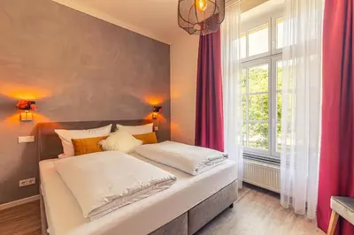Ein Bett oder Betten in einem Zimmer der Unterkunft Rochter Landhotel