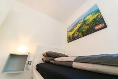 Ein Bett oder Betten in einem Zimmer der Unterkunft North Loop Rooms