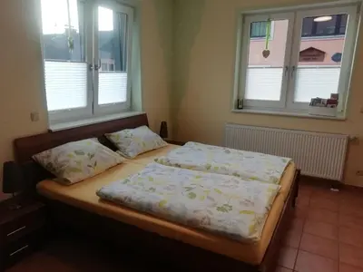 Ein Bett oder Betten in einem Zimmer der Unterkunft Ferienwohnung Hermann