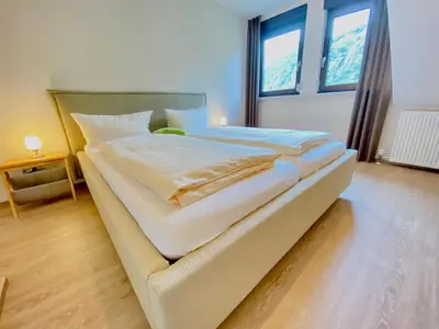 Ein Bett oder Betten in einem Zimmer der Unterkunft Pension / Ferienwohnungen Scheid