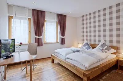 Ein Bett oder Betten in einem Zimmer der Unterkunft Weingut Gästehaus Derkum