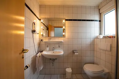 Ein Badezimmer in der Unterkunft Hotel Schatulle