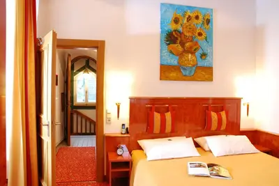 Ein Bett oder Betten in einem Zimmer der Unterkunft Hotel ZUM TURM