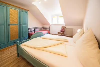 Ein Bett oder Betten in einem Zimmer der Unterkunft Alter Posthof Ferienwohnungen