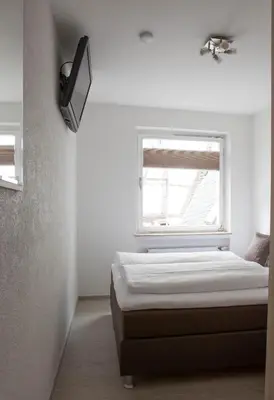 Ein Bett oder Betten in einem Zimmer der Unterkunft Hotel am Markt