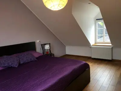 Ein Bett oder Betten in einem Zimmer der Unterkunft Ferienwohnung in historischem Bauernhaus in der Eifel