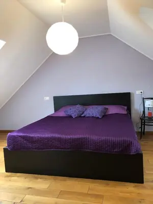 Ein Bett oder Betten in einem Zimmer der Unterkunft Ferienwohnung in historischem Bauernhaus in der Eifel