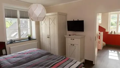 Ein Bett oder Betten in einem Zimmer der Unterkunft Ferienhaus Alte Schule