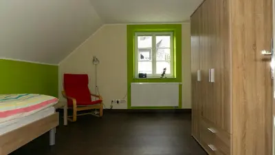 Ein Bett oder Betten in einem Zimmer der Unterkunft Ferienhaus Alte Schule