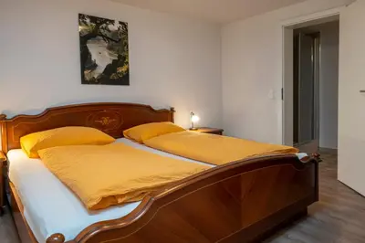 Ein Bett oder Betten in einem Zimmer der Unterkunft Schusters Haus - Ferienhaus