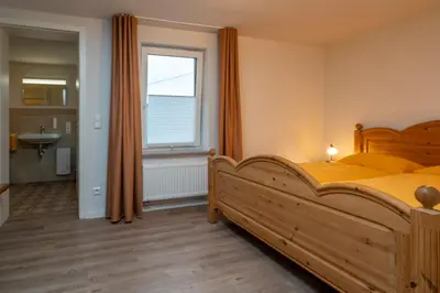 Ein Bett oder Betten in einem Zimmer der Unterkunft Schusters Haus - Ferienhaus