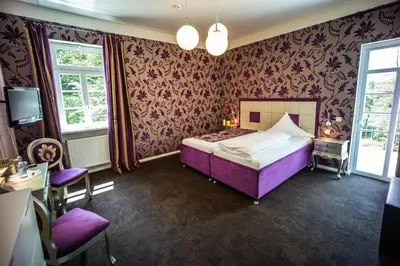 Ein Bett oder Betten in einem Zimmer der Unterkunft Domäne am See
