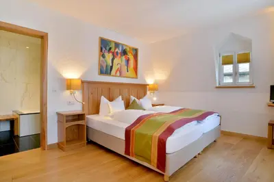 Ein Bett oder Betten in einem Zimmer der Unterkunft Hotel Haus Lipmann