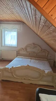 Ein Bett oder Betten in einem Zimmer der Unterkunft Holzfeld