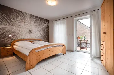 Ein Bett oder Betten in einem Zimmer der Unterkunft Weingut Josef Ehses