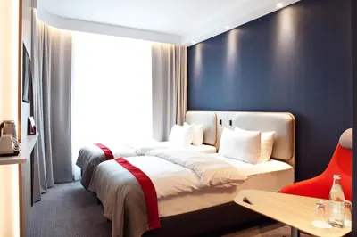 Ein Bett oder Betten in einem Zimmer der Unterkunft Holiday Inn Express - Trier by IHG
